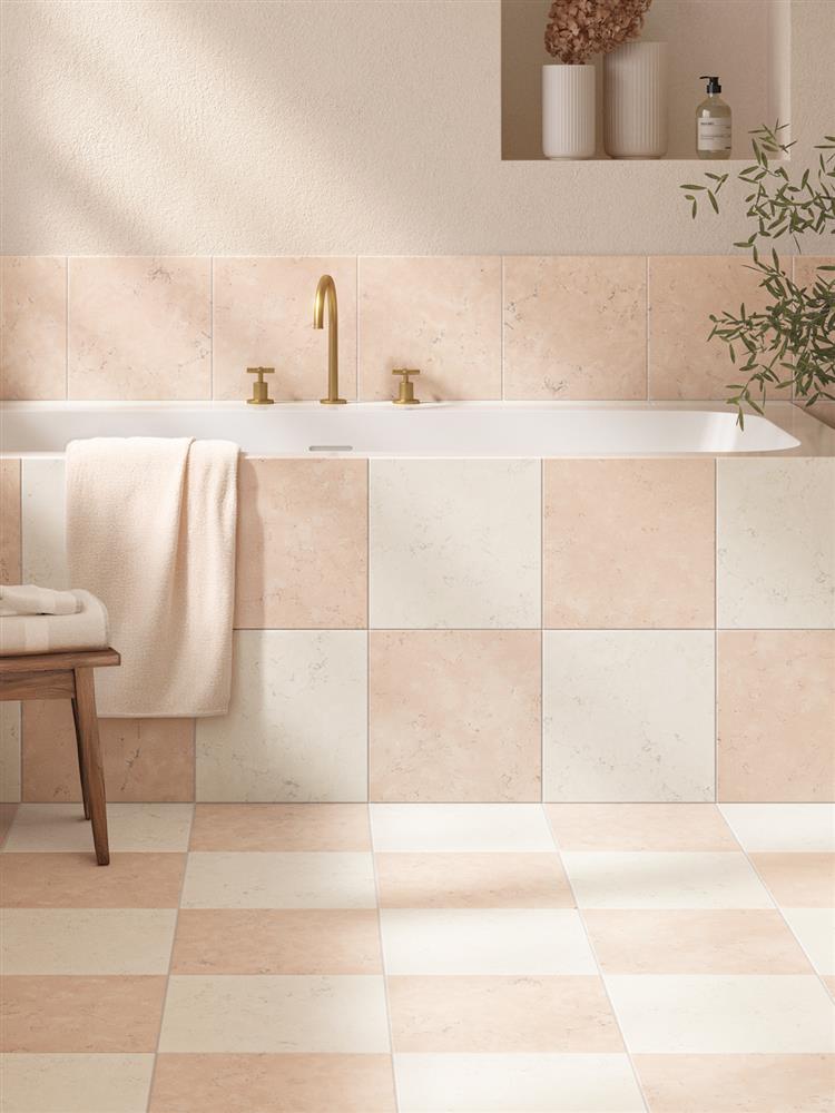 Checkerboard pink and cream marble tiles in a modern bathroom